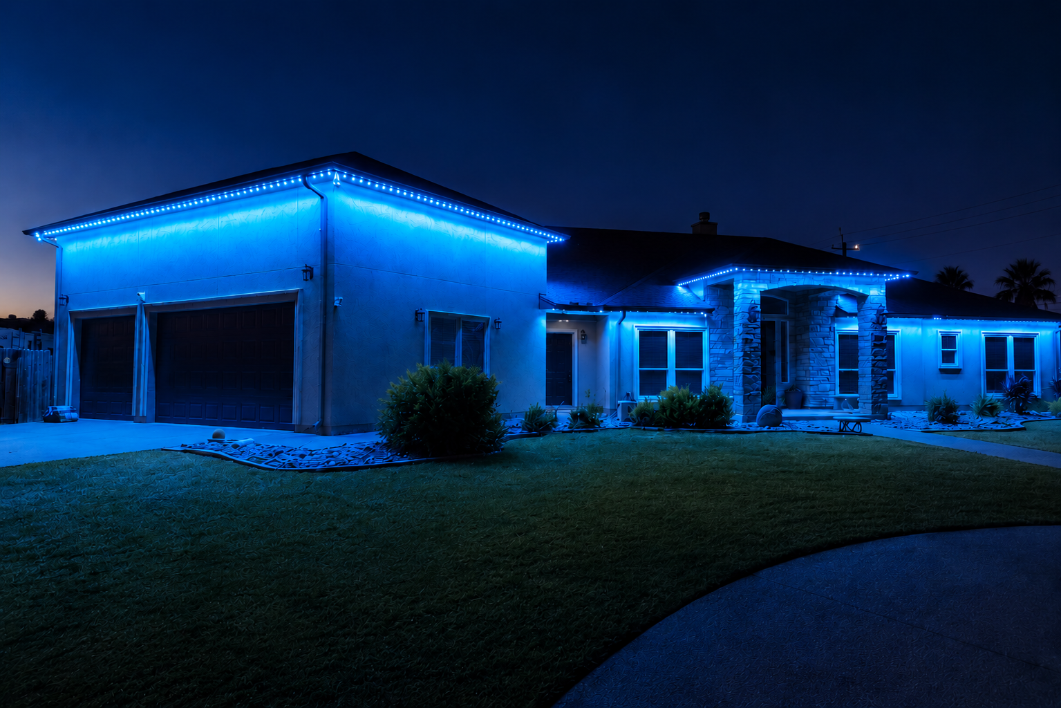 Beautiful home with permanent LED roofline lighting at dusk